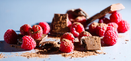 red Raspberry fruit on gray background chocolate
