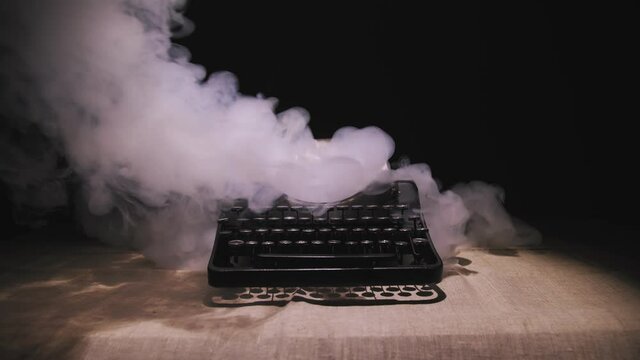 Old typewriter in the old room, retro interior, old style.