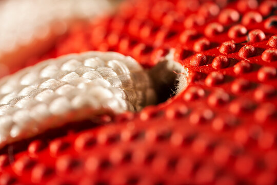Extreme macro photo of an AFL football. Sports background.