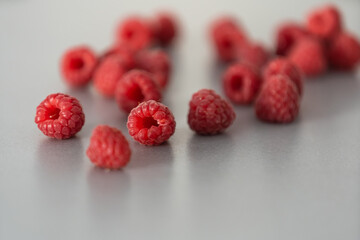 red Raspberry fruit on gray background