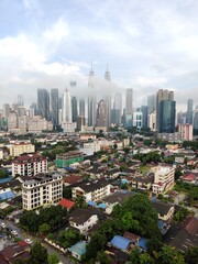 Kuala Lumpur, Malaysia - July 16, 2020: View of Kuala Lumpur skyline during after rain. 