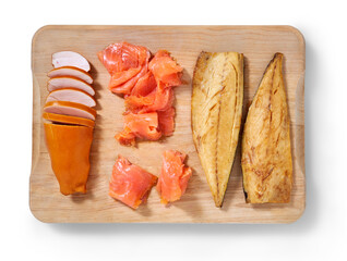 Smoked chicken, mackerel and salmon on a cutting in a studio setting isolated on white