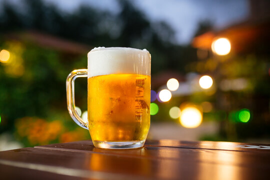Beer foam outside with blurry lights background