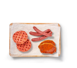 Raw meat in a studio setting, on a cutting board