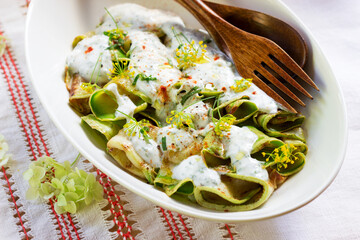 Grilled zucchini salad with yogurt dressing with garlic, dill and mint. A traditional dish of Turkish cuisine.