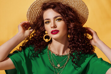 Summer fashion portrait of beautiful curly woman with yellow eyes, fuchsia color lips makeup,...