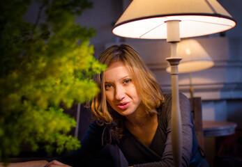 Young girl in the old-fashioned cosy place