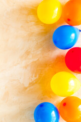 Flat lay with ballons - party concept - on beige background top-down copy space