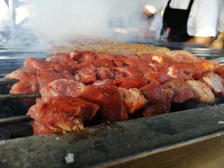 Shashlik preparing on a barbecue grill over charcoal. Shashlik or Shish kebab popular in Eastern Europe.