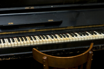 Fototapeta na wymiar Chair in front of piano