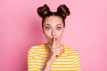 Fototapeta premium Close-up portrait of her she nice-looking attractive lovely pretty charming cute funky feminine cheery girl showing shh sign don't speak isolated over pink pastel color background