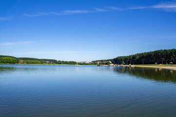 Fototapeta na wymiar Blue lake with sky reflection in the water