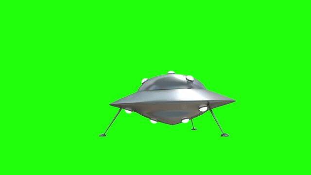 UFO is landing in the Studio on a chroma key. 3D render and mask for isolated video. 