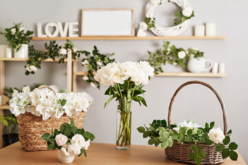 Floral background. Flower shop interior. Floral design studio, making decorations and arrangements. Flowers delivery service and sale of home plant, creating order. Peonies and roses.