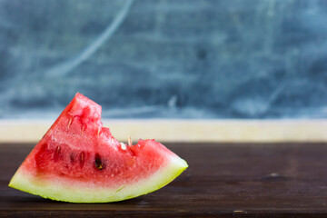 A half-eaten juicy piece of watermelon.