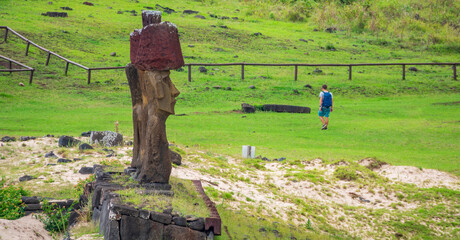 Profile view of moai platform and single tourist