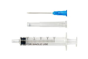 Disassembled disposable syringe isolated on white. Parts of medical injector: needle and protective...