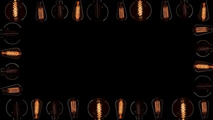 A lot of Edison bulbs creating great background for logo or title. Blinking lamps black background...