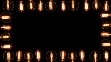 A lot of Edison bulbs creating great background for logo or title. Blinking lamps black background...