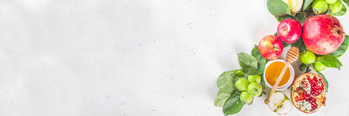 Rosh hashanah, jewish New Year holiday concept, banner. With traditional symbols, apples, pomegranate, honey. Rosh hashanah greeting card background.