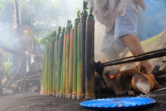 The process of making lemang in Pekanbaru, Riau, Indonesia. Lemang is a food made from glutinous rice which is put into bamboo and given coconut milk and other spices and then burned until cooked.