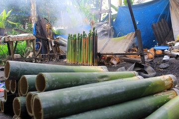 The process of making lemang in Pekanbaru, Riau, Indonesia. Lemang is a food made from glutinous rice which is put into bamboo and given coconut milk and other spices and then burned until cooked.