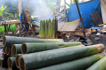 The process of making lemang in Pekanbaru, Riau, Indonesia. Lemang is a food made from glutinous...