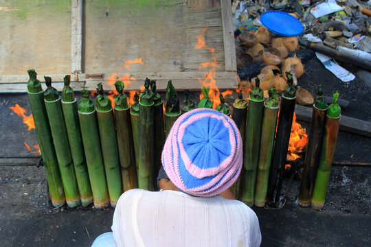The process of making lemang in Pekanbaru, Riau, Indonesia. Lemang is a food made from glutinous rice which is put into bamboo and given coconut milk and other spices and then burned until cooked.