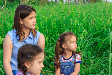 Girls on a walk. Girls on a picnic. Girl with a camera. Field of lupine.