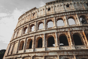 Architectural details of the facade of the Colosseum (Coliseum) or Flavian Amphitheatre, the largest Roman amphitheater located in city of Rome, Italy