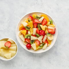 Fresh chopped fruit salad in a bowl.
