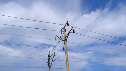 
Electric pole with wires in the countryside
