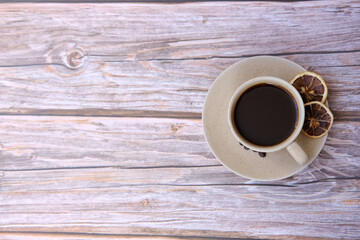 Top view coffee cup and coffee beans on wood table, space for text