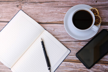 Top view coffee cup and coffee beans on wooden table background and space for text 