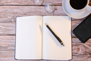 Top view coffee cup and coffee beans on wooden table background and space for text 