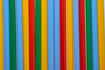 Obraz premium Abstract Background Multicolored Plastic Drinks Tubes. Close-up.
