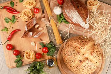 close up view on bread with tomato and rosemary, garlic,basil,spaghetti,sunflower oil and rosemary on background 
