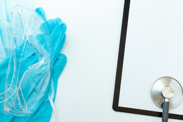 Stethoscope on light background, medical supplies and free space for text