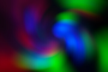 Blurred abstract gradient wave green, pink, blue, blurry christmas and holiday lights background. Multicolored, bright spiral vortex in the dark