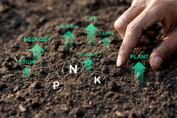A man's hand is touching onto a loam suitable for crop and agriculture.