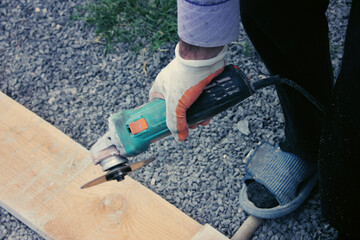 Manual worker work in factory with grinder