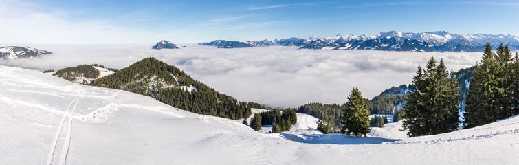 Amazing panoramic View from Snow Mountain to snowy Mountain Range above foggy cloud layer. Sea of...