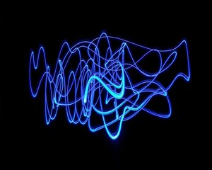 Light painting design. Combination of sky blue and white light against a black background 