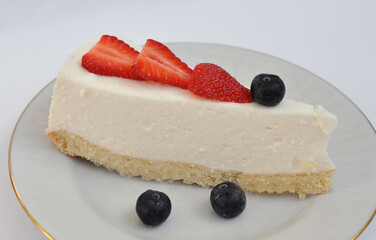 sweet tasty cheesecake with berries on a plate