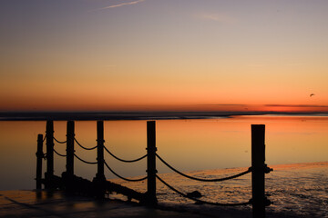Fototapeta premium Rising sun over De Waddenzee naer Den Helder