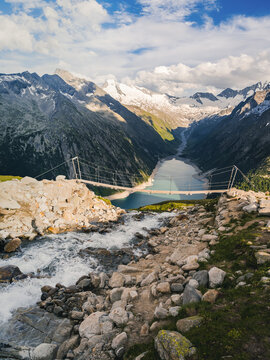 Hiking to the Olpererhutte or Olperer Hut in the Zillertal Alps is an experience that challenges all the senses. Famous instagram swing bridge. Landscape vacation trip, lifestyle holiday concept