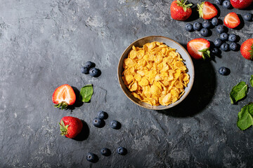 Golden cerials served with strawberry, blueberry