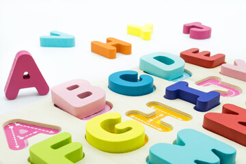 Colorful wooden educational abc toy puzzle for kids.