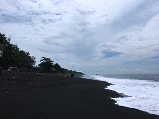 Asian country Indonesia. Bali island. Nusa penida, black sand beach and ocean