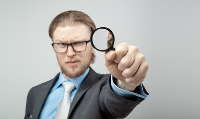 portrait one man businessman with magnifying glass